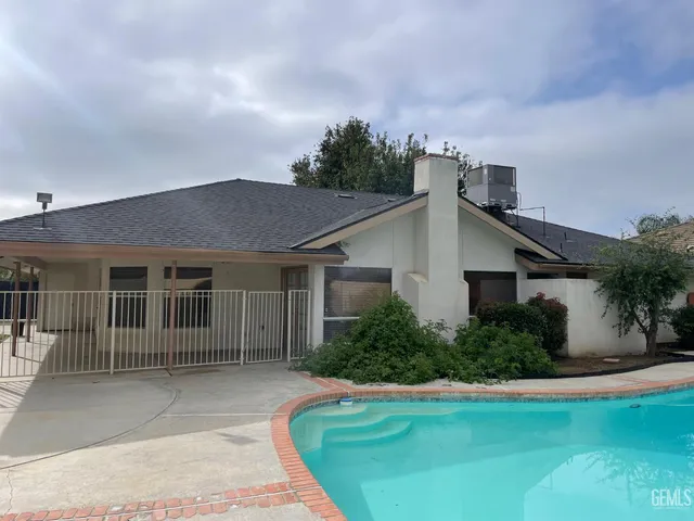 a house with trees in the background