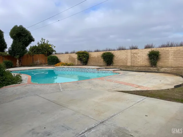 a view of parking space with city view