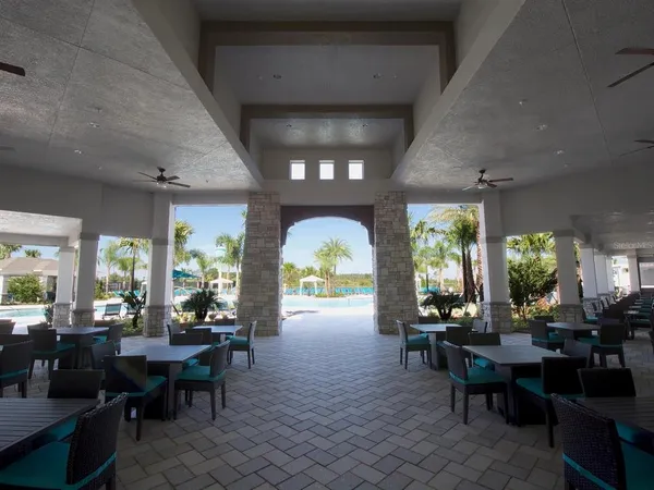 a outdoor space with lots of white furniture