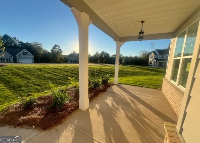 a view of staircase with wooden floor and white walls