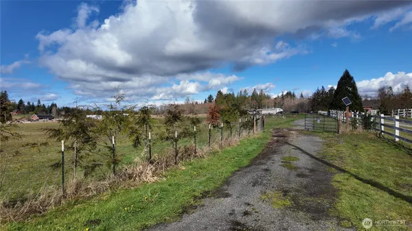 a view of a lake with houses in back