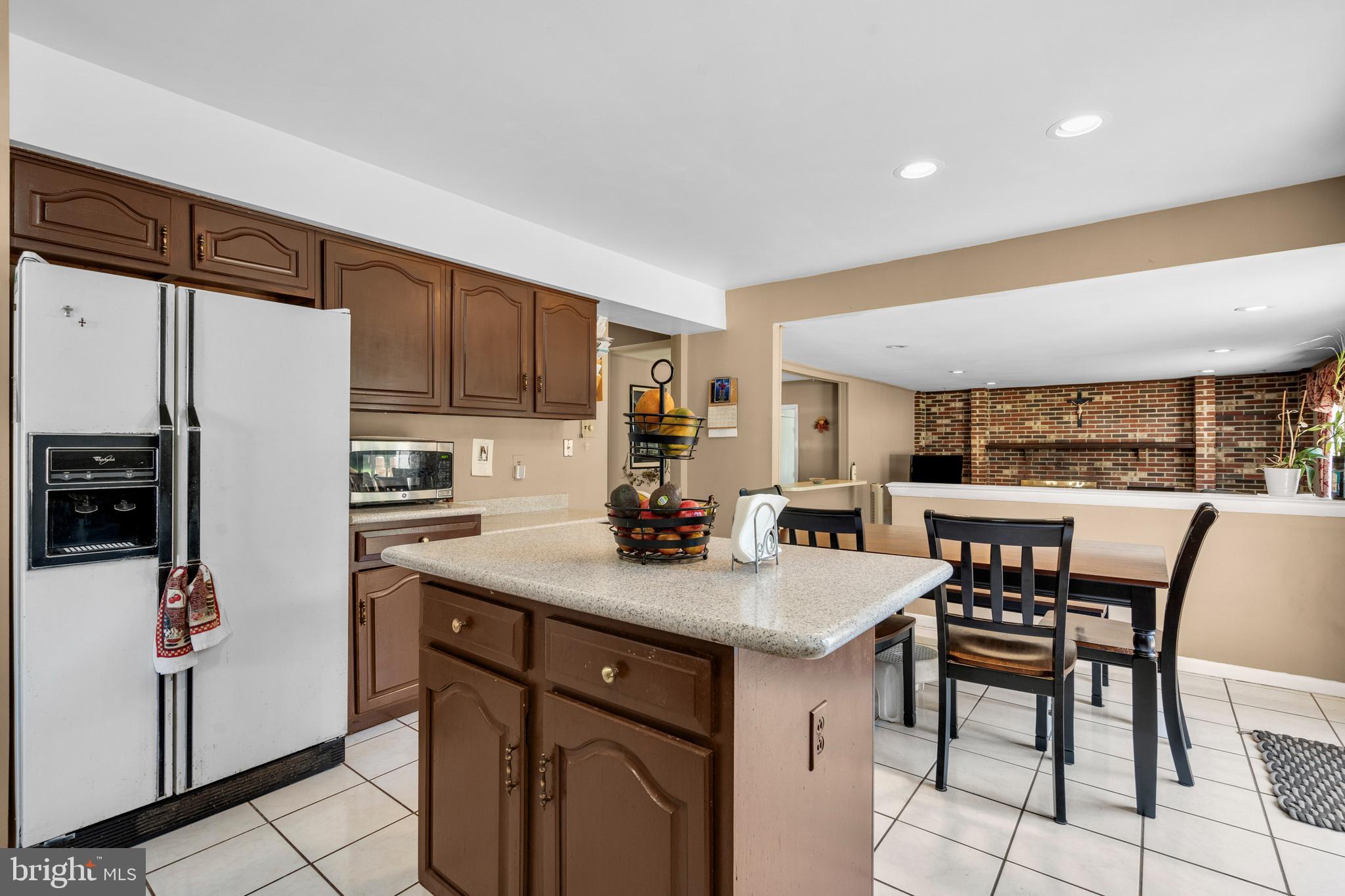 2 West High Ridge Road Cherry Hill, NJ 08003 - Photo 11 of 42 a kitchen with a table chairs refrigerator and cabinets