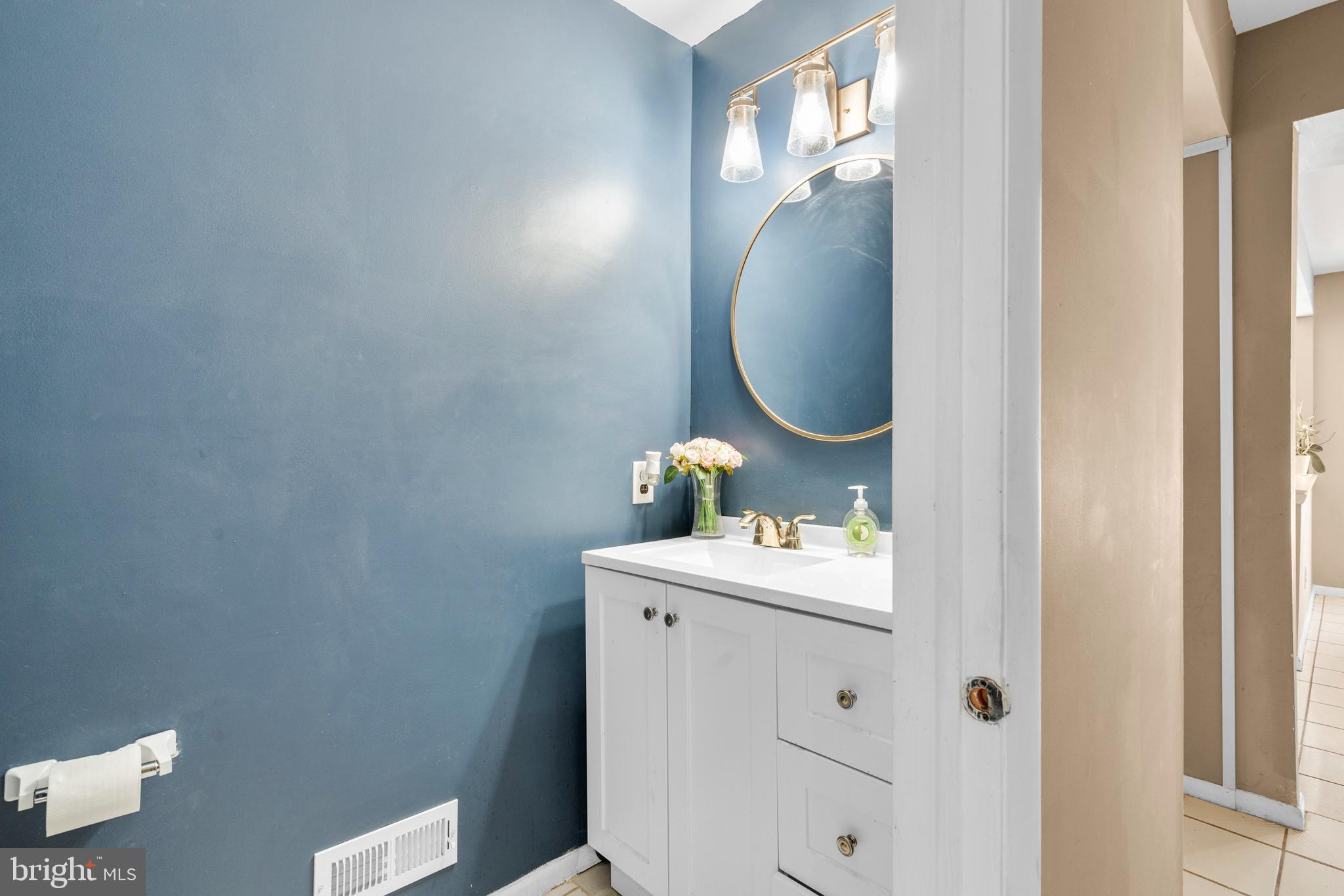 2 West High Ridge Road Cherry Hill, NJ 08003 - Photo 13 of 42 a bathroom with a sink and mirror