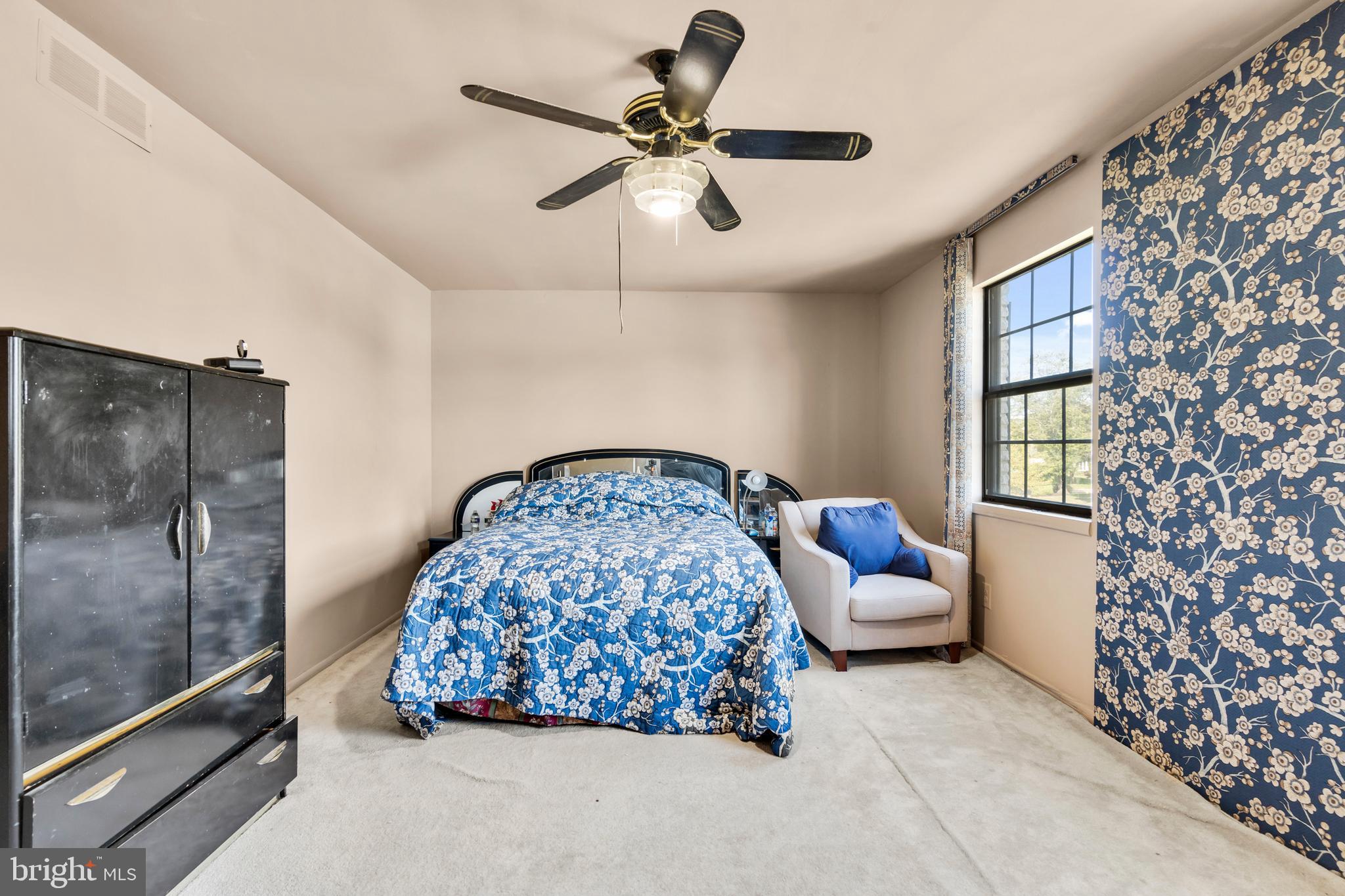 2 West High Ridge Road Cherry Hill, NJ 08003 - Photo 19 of 42 a bedroom with bed and a chandelier