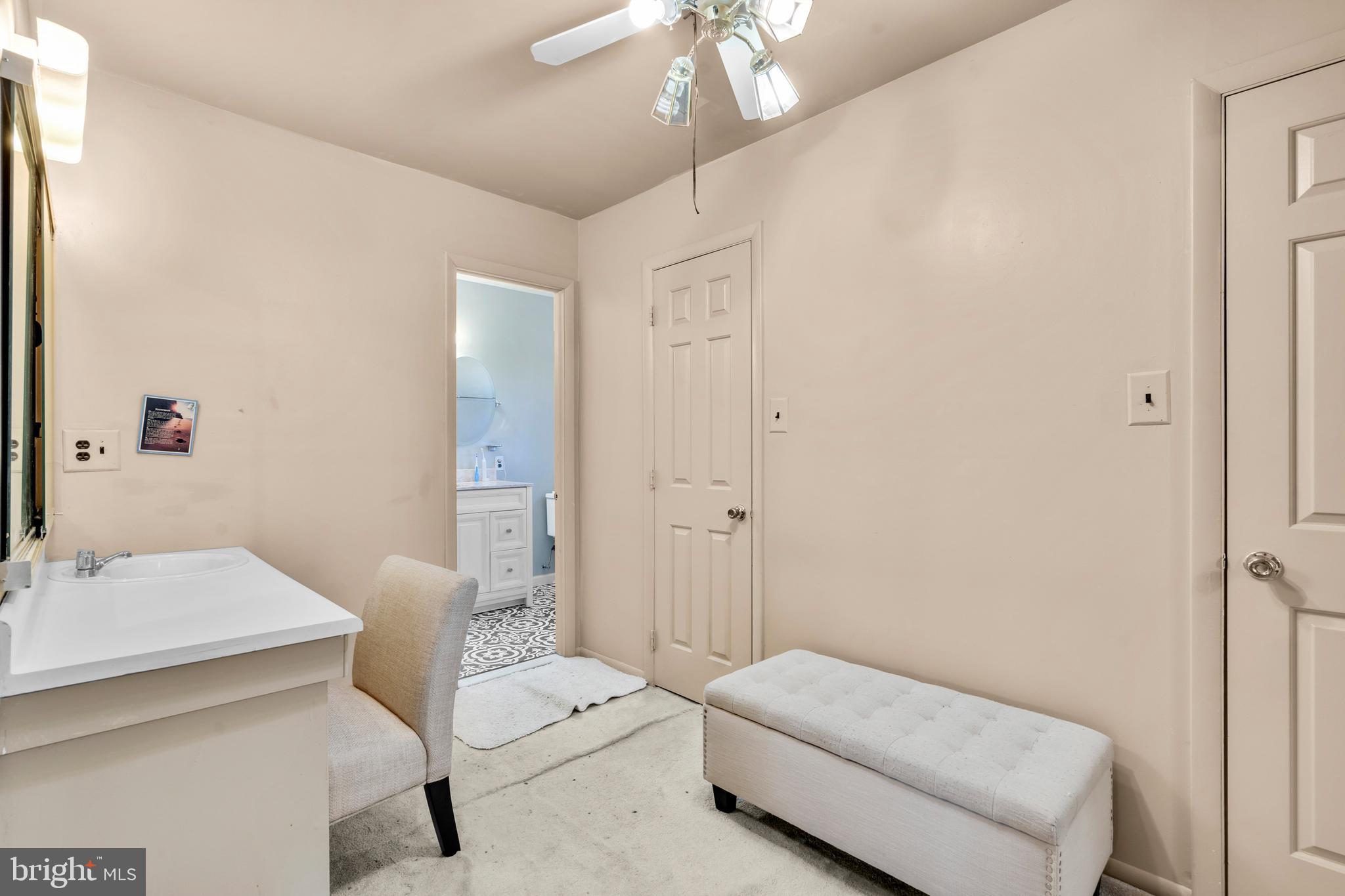 2 West High Ridge Road Cherry Hill, NJ 08003 - Photo 20 of 42 a room with a bed and a chandelier