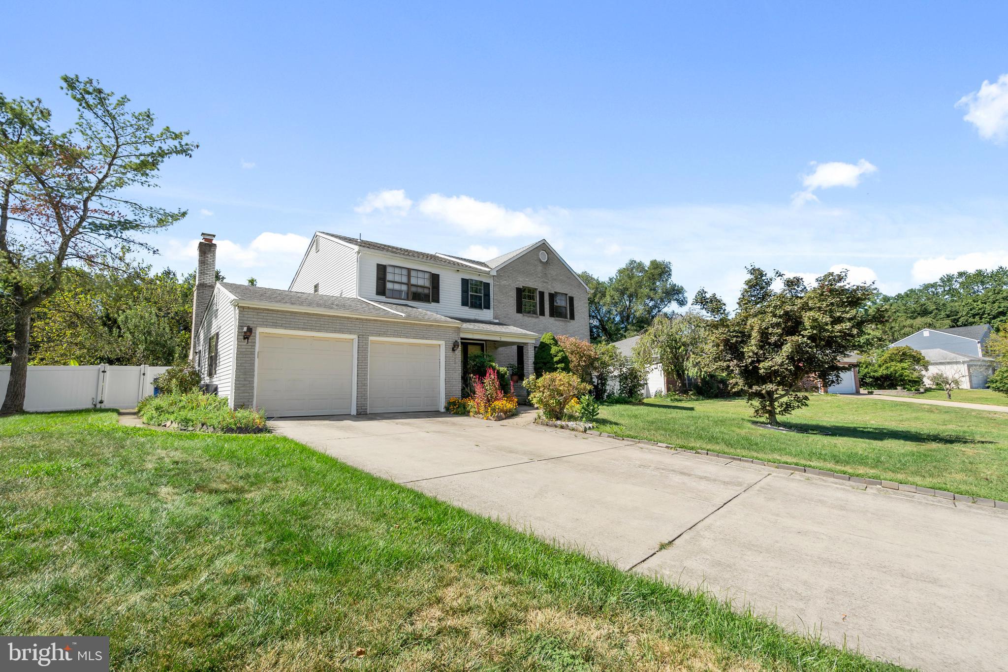 2 West High Ridge Road Cherry Hill, NJ 08003 - Photo 2 of 42 a front view of a house with a yard and trees
