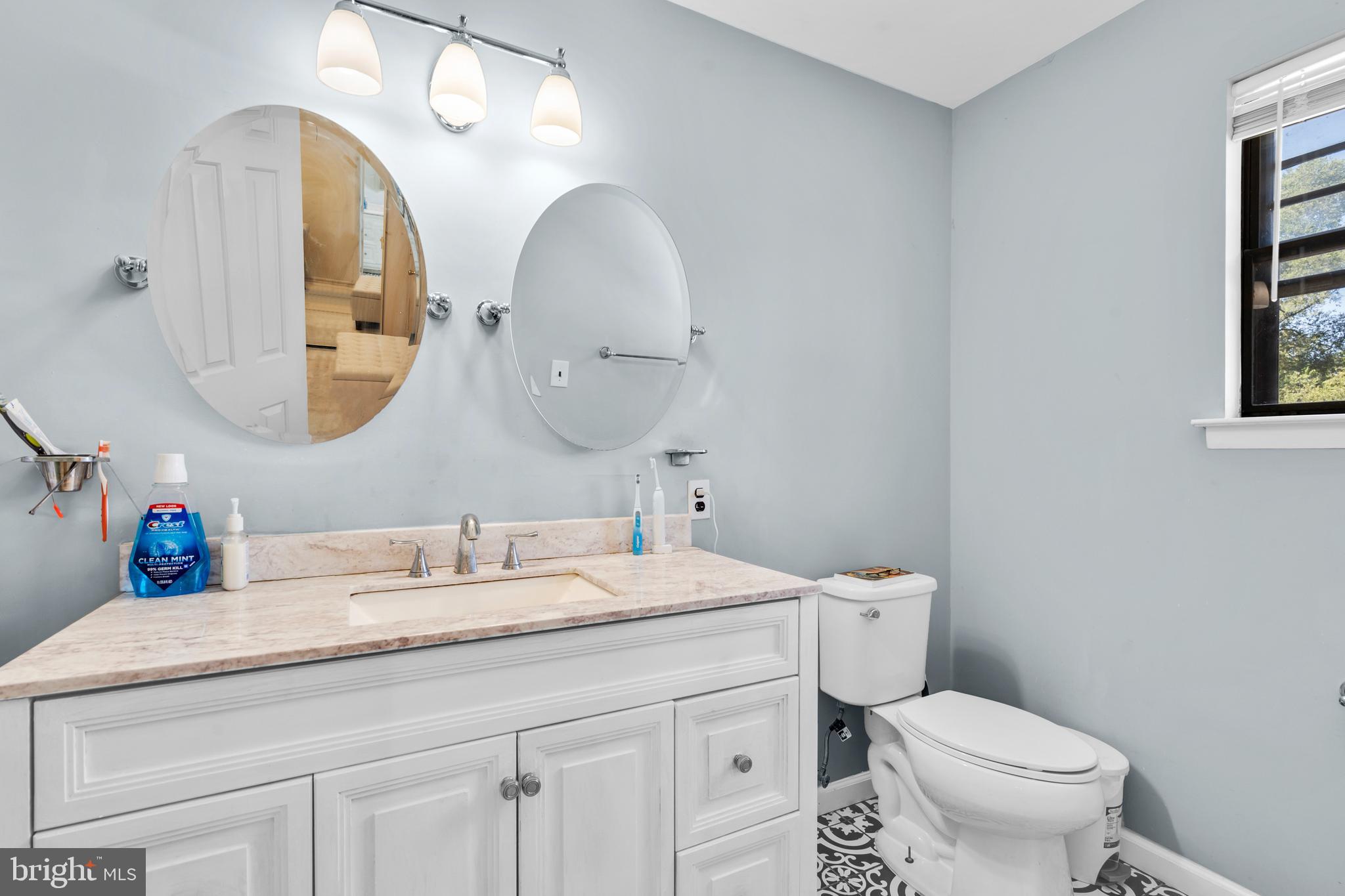 2 West High Ridge Road Cherry Hill, NJ 08003 - Photo 21 of 42 a bathroom with a toilet a sink and a mirror