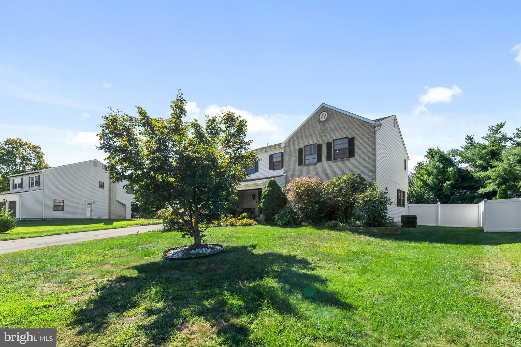 2 West High Ridge Road Cherry Hill, NJ 08003 - Photo 3 of 42 a front view of a house with garden and trees
