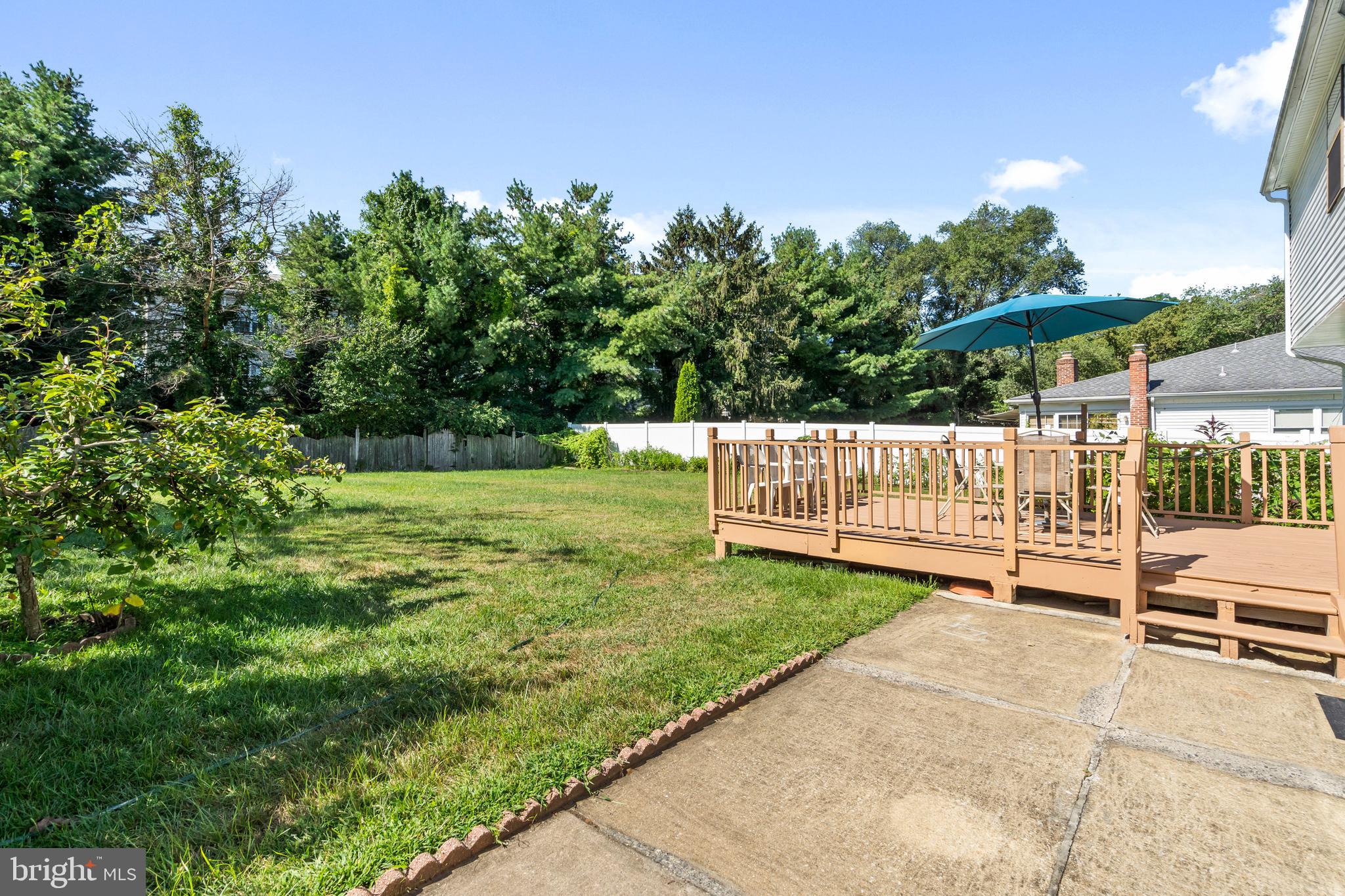 2 West High Ridge Road Cherry Hill, NJ 08003 - Photo 31 of 42 a view of backyard with a garden and deck