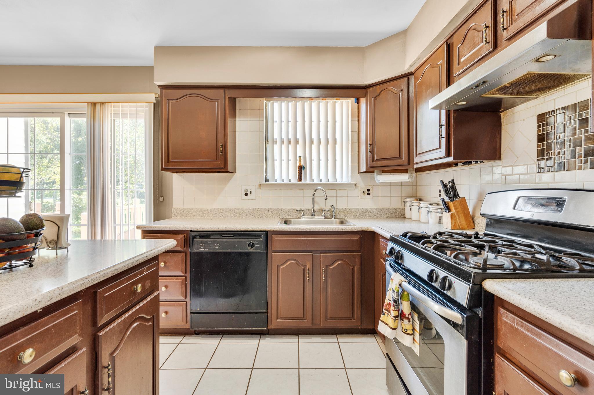 2 West High Ridge Road Cherry Hill, NJ 08003 - Photo 10 of 42 a kitchen with stainless steel appliances a sink stove and cabinets