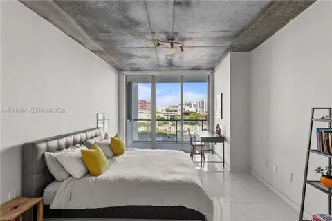 a bedroom with a bed and a table