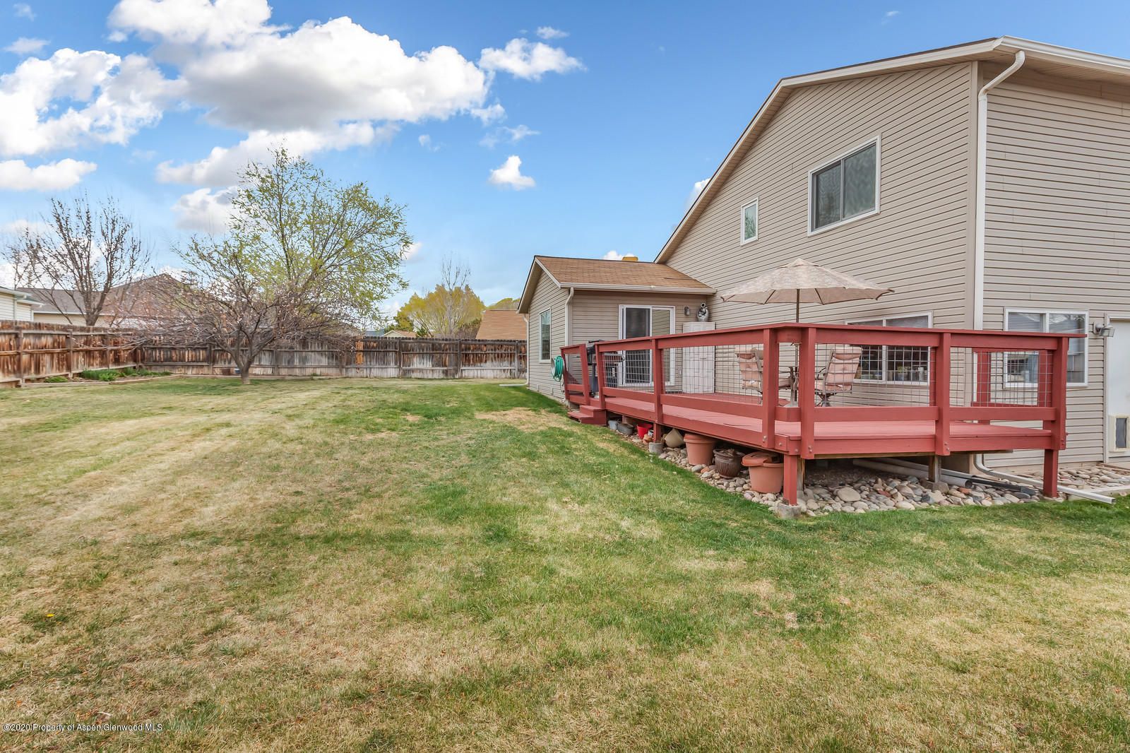 1543 Beech Street Rifle, CO 81650 - Photo 16 of 20 a view of a house with a yard