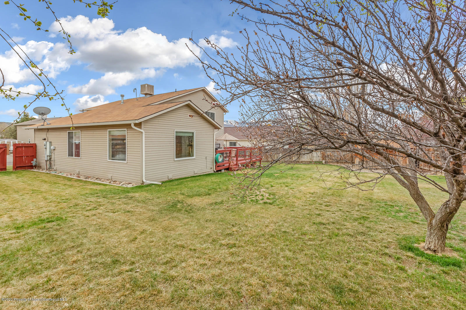1543 Beech Street Rifle, CO 81650 - Photo 17 of 20 a view of a backyard with large trees
