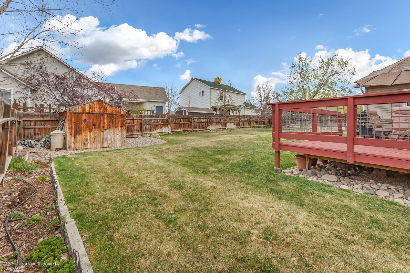 1543 Beech Street Rifle, CO 81650 - Photo 19 of 20 a view of a house with a yard