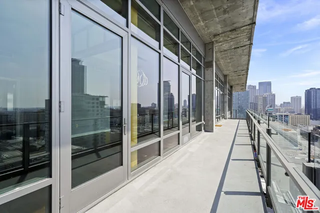 a balcony with view of car parked