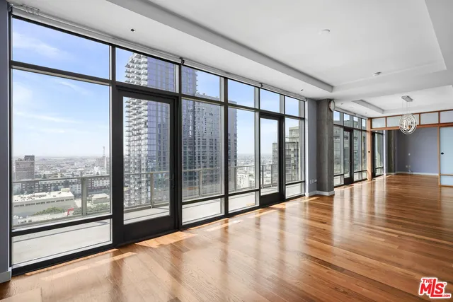 a view of an entryway with wooden floor