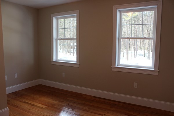 90 Long Ridge Road Carlisle, MA 01741 - Photo 18 of 21 a view of an empty room with wooden floor and a window