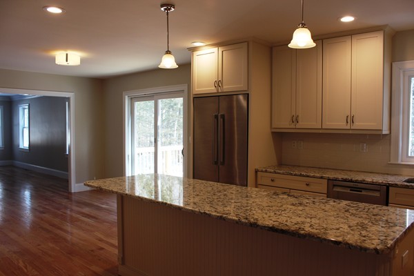 90 Long Ridge Road Carlisle, MA 01741 - Photo 5 of 21 a kitchen with stainless steel appliances granite countertop a refrigerator a stove and a wooden floors