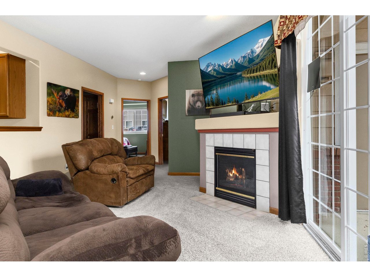 5151 29th Street, Unit 1203 Greeley, CO 80634 - Photo 4 of 20 Cozy fireplace in the living room