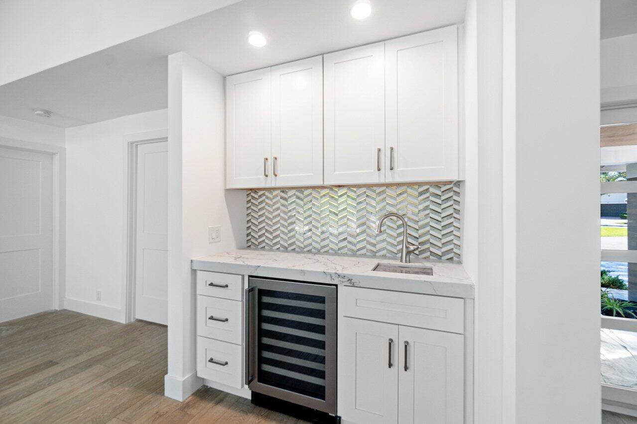 914 Foxpointe Circle Delray Beach, FL 33445 - Photo 16 of 19 a view of a storage and utility room with washer and dryer