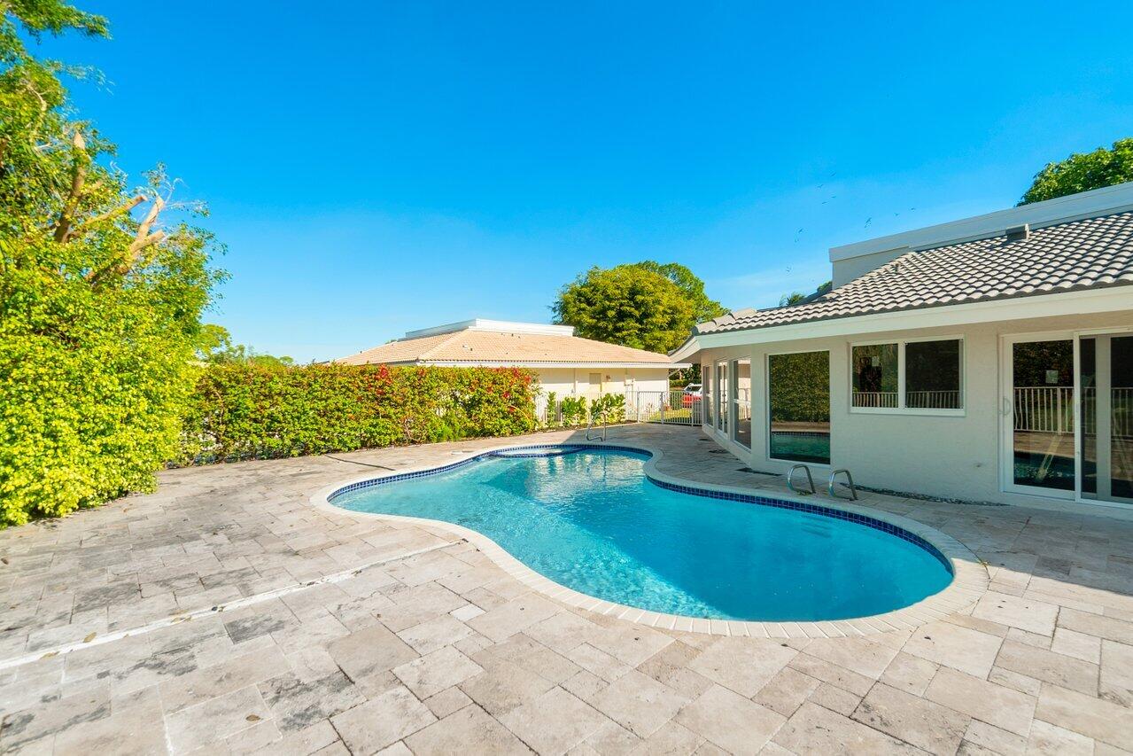 914 Foxpointe Circle Delray Beach, FL 33445 - Photo 19 of 19 a view of a house with swimming pool