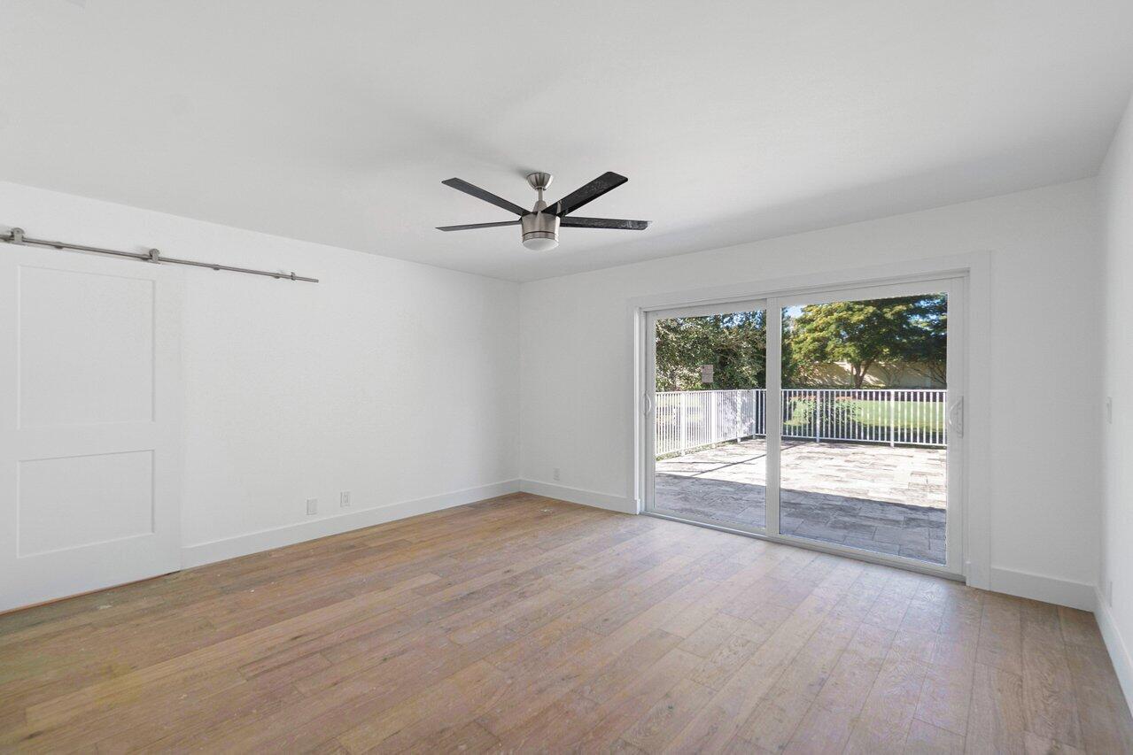 914 Foxpointe Circle Delray Beach, FL 33445 - Photo 5 of 19 a view of an empty room with a window
