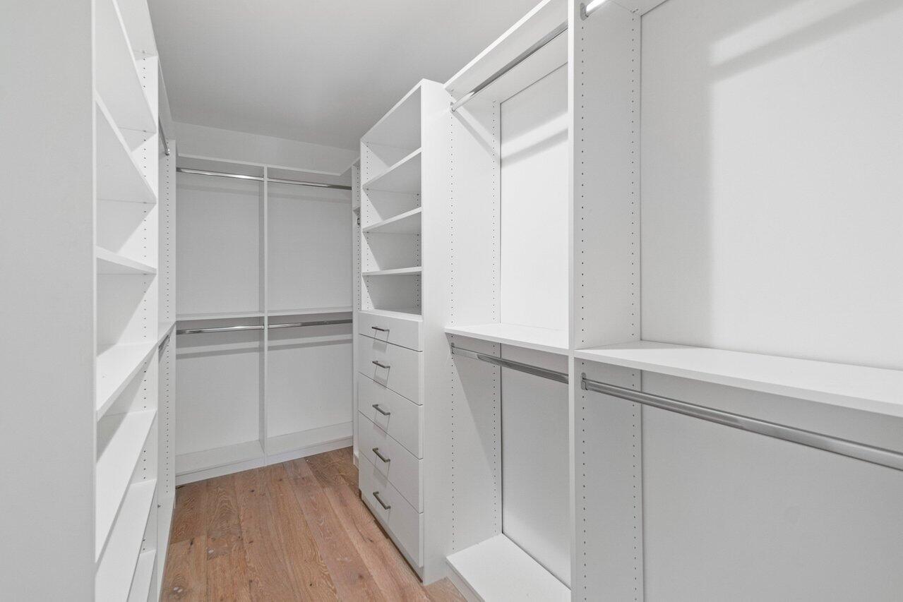 914 Foxpointe Circle Delray Beach, FL 33445 - Photo 7 of 19 a view of walk in closet with empty racks
