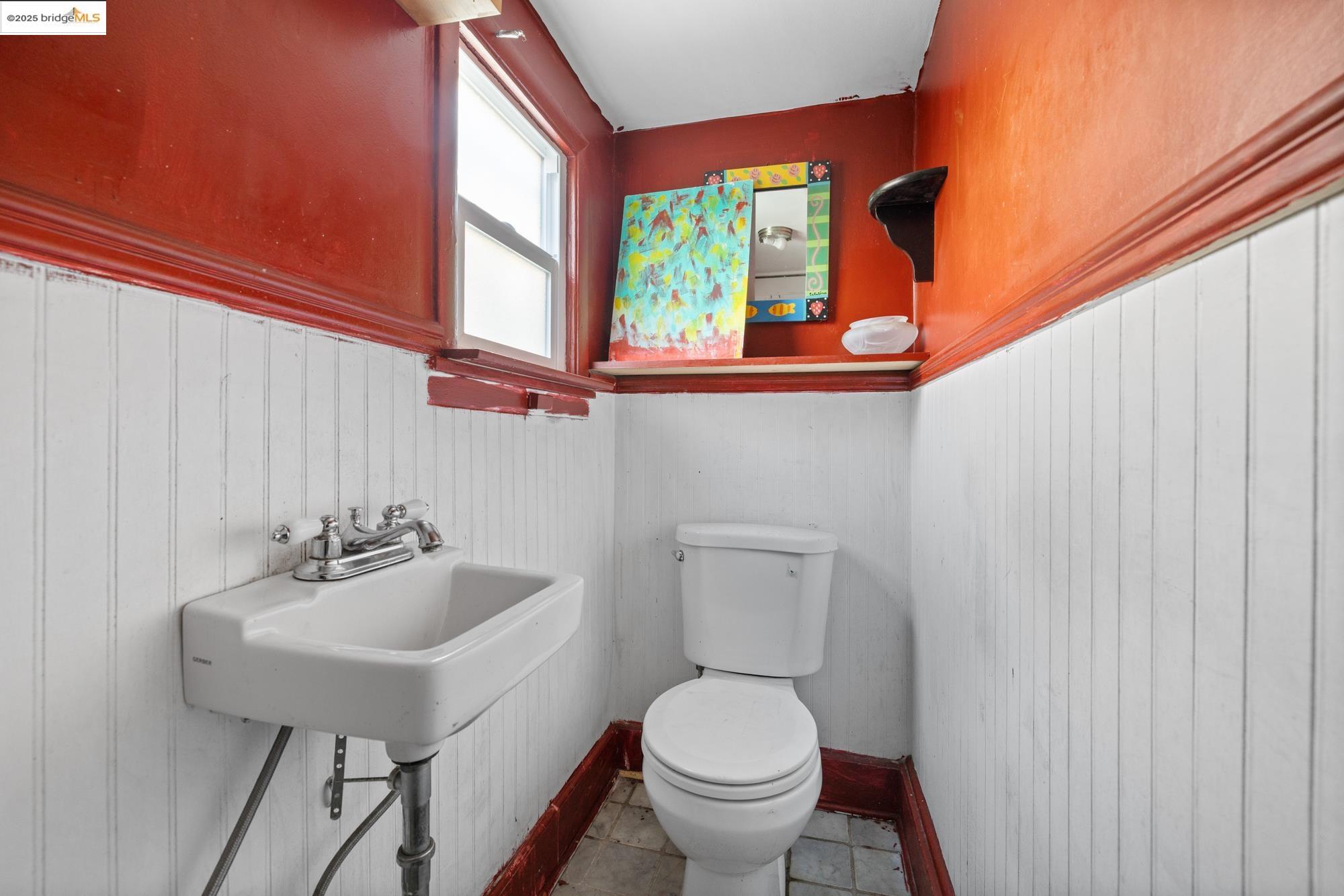 1746 8th Street Oakland, CA 94607 - Photo 14 of 52 a bathroom with a sink toilet and a mirror