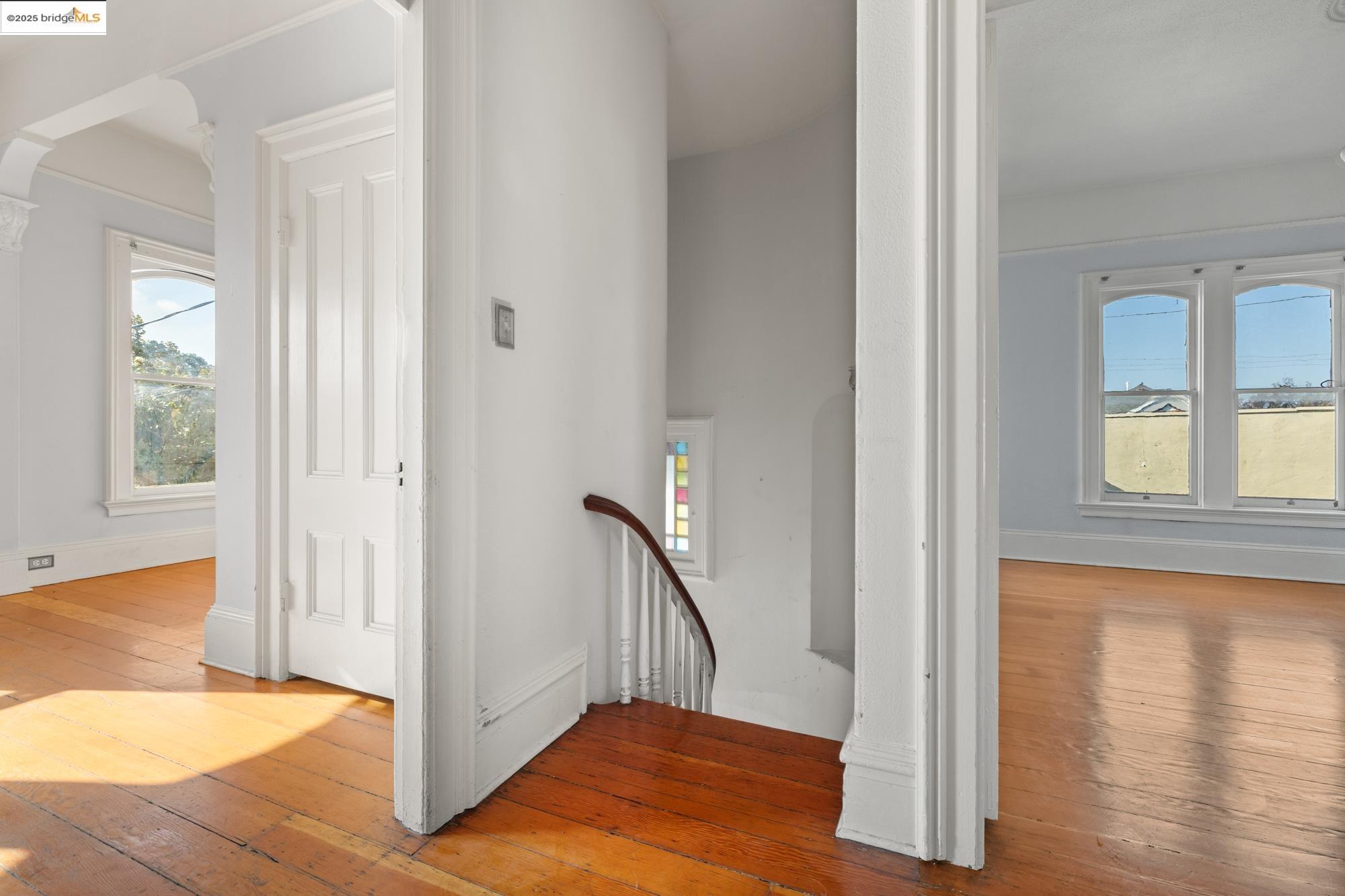 1746 8th Street Oakland, CA 94607 - Photo 17 of 52 a view of entryway with wooden floor and stair