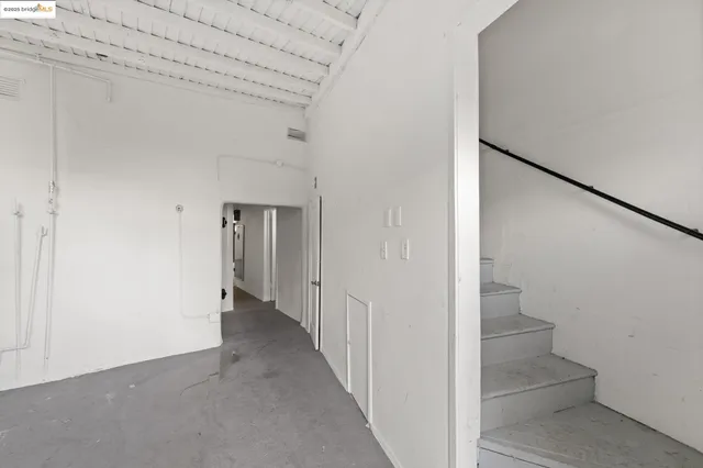 a view of a hallway with staircase