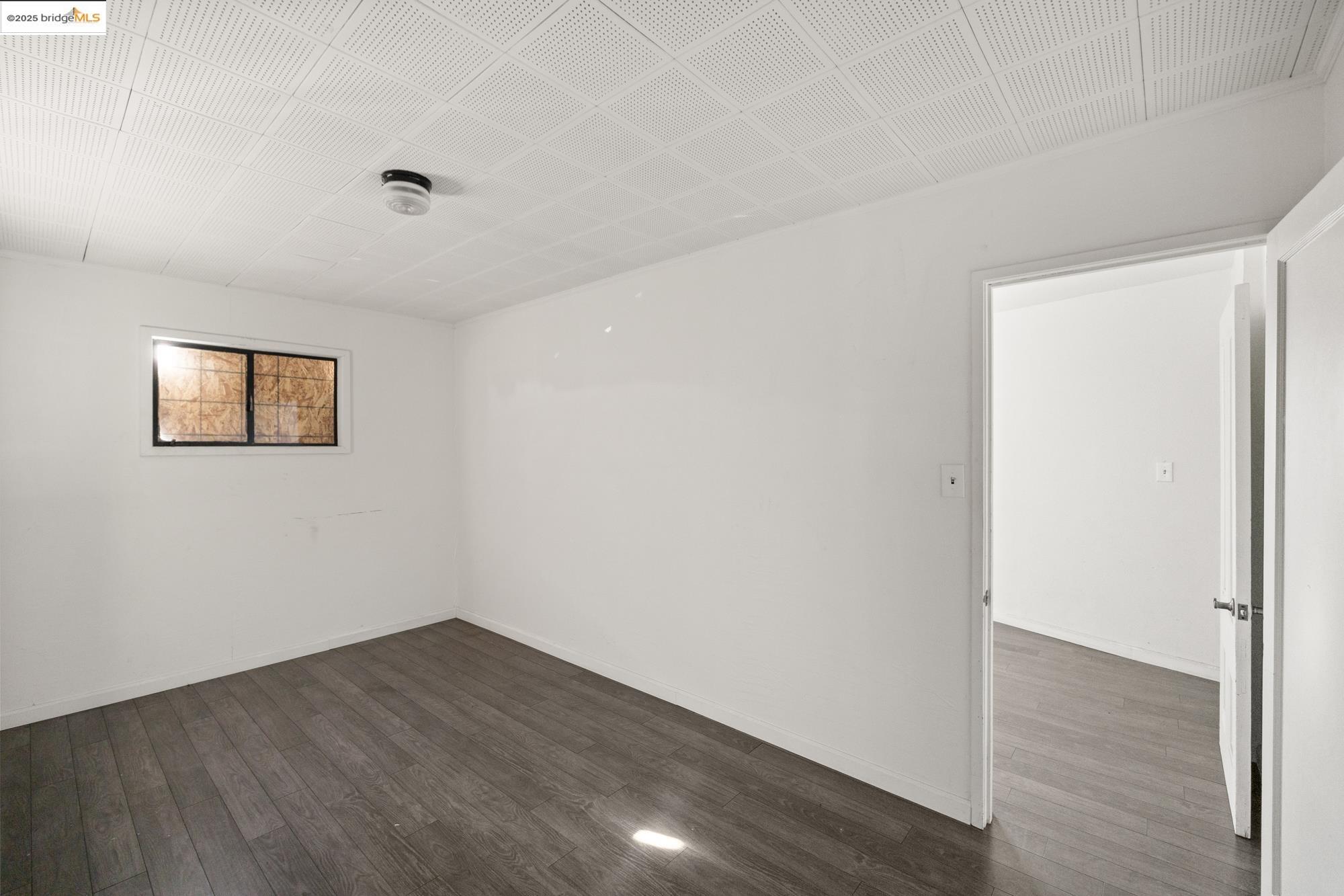 1746 8th Street Oakland, CA 94607 - Photo 43 of 52 a view of a room with wooden floor and white walls