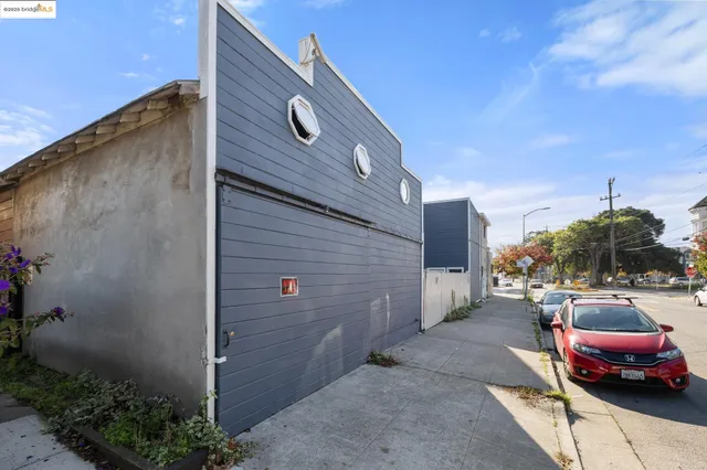 a backyard of a house with outdoor seating