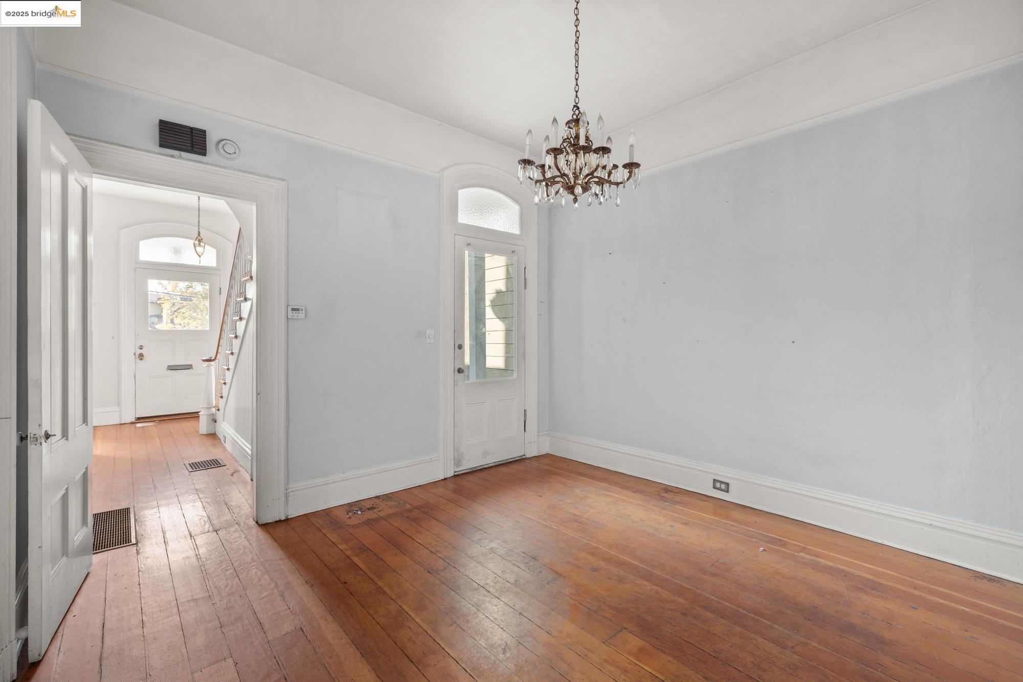 1746 8th Street Oakland, CA 94607 - Photo 10 of 52 wooden floor in an empty room with a window