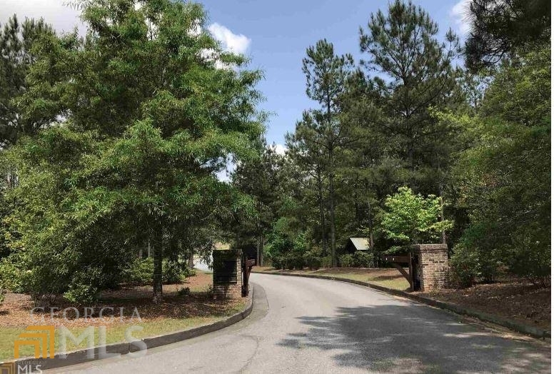 56 Firefly Run LaGrange, GA 30240 - Photo 1 of 1 a view of a swimming pool with an outdoor space and seating area