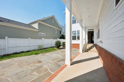 a view of a porch in front of house