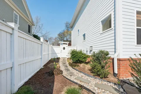 a view of a house with a tree