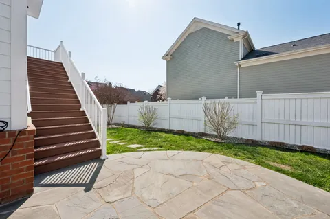 a view of a porch with wooden floor and stairs