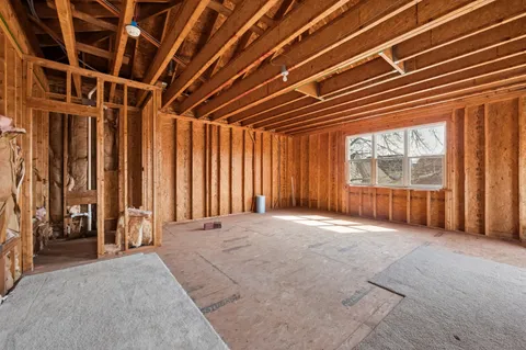 a view of a house with a yard and flower plants