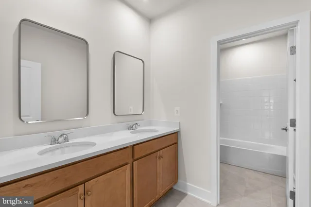 a bathroom with a bathtub and a toilet