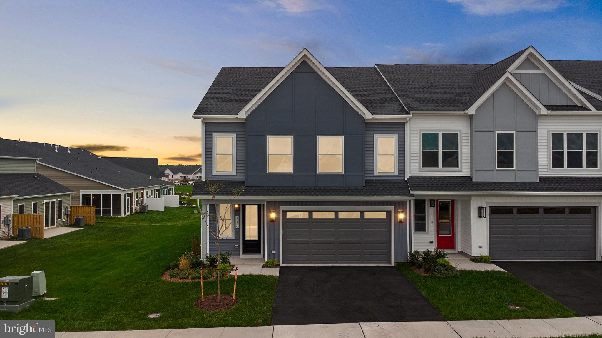 116 Keystone Lane, Unit HOMESITE 1097 Winchester, VA 22603 - Photo 32 of 42 a front view of a house with a yard and garage