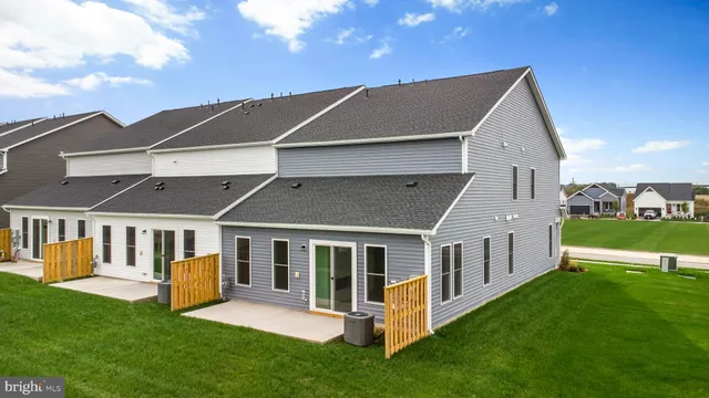 a aerial view of a house with a yard