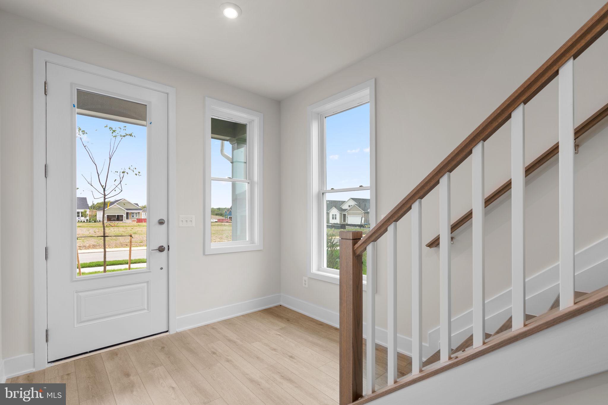 116 Keystone Lane, Unit HOMESITE 1097 Winchester, VA 22603 - Photo 7 of 42 a view of entryway with wooden floor and stairs
