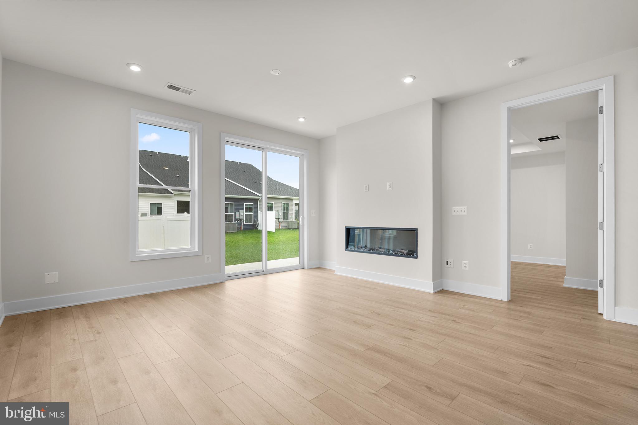 116 Keystone Lane, Unit HOMESITE 1097 Winchester, VA 22603 - Photo 10 of 42 a view of an empty room with a window and wooden floor