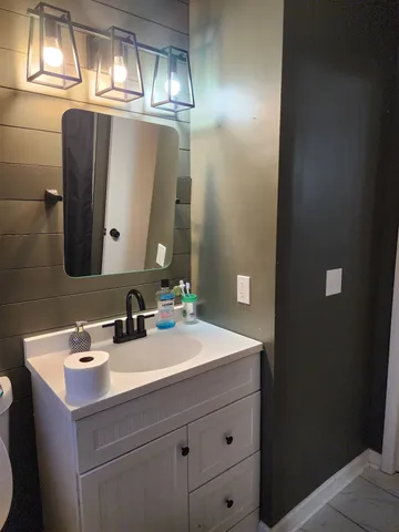 a bathroom with a sink and a mirror