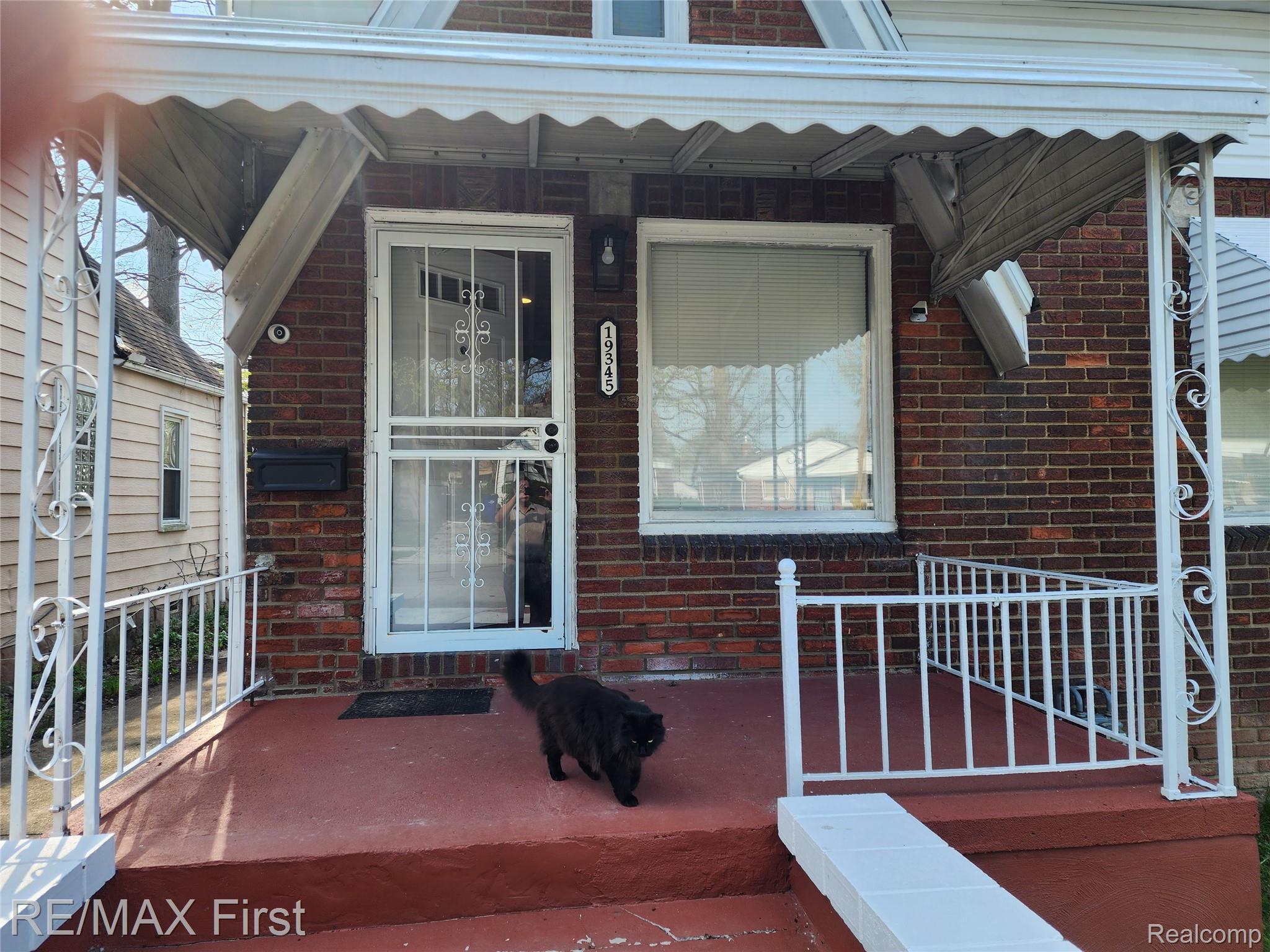19345 Keystone Street Detroit, MI 48234 - Photo 15 of 15 Doorway to property featuring brick siding and a porch