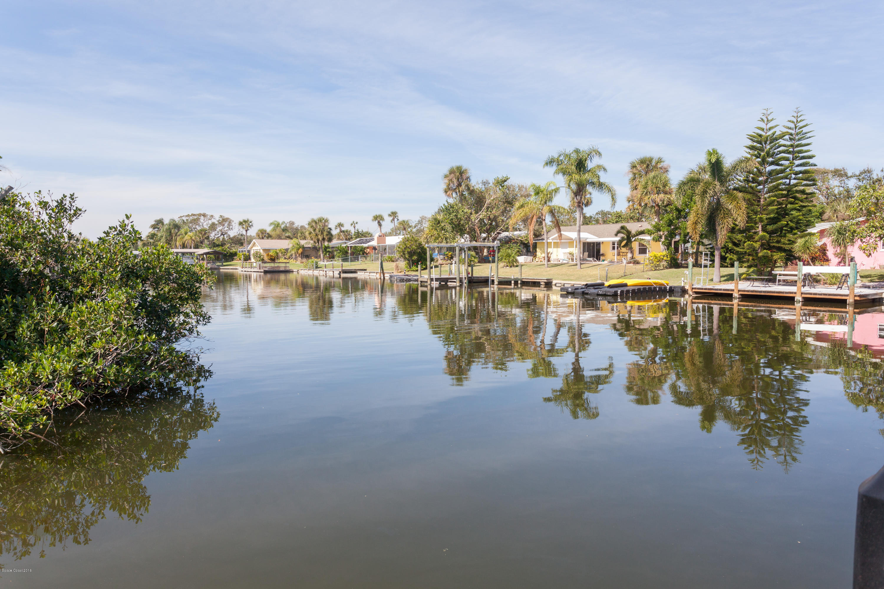 1035 Trinidad Road Cocoa Beach, FL 32931 - Photo 1 of 23 a view of a lake with houses