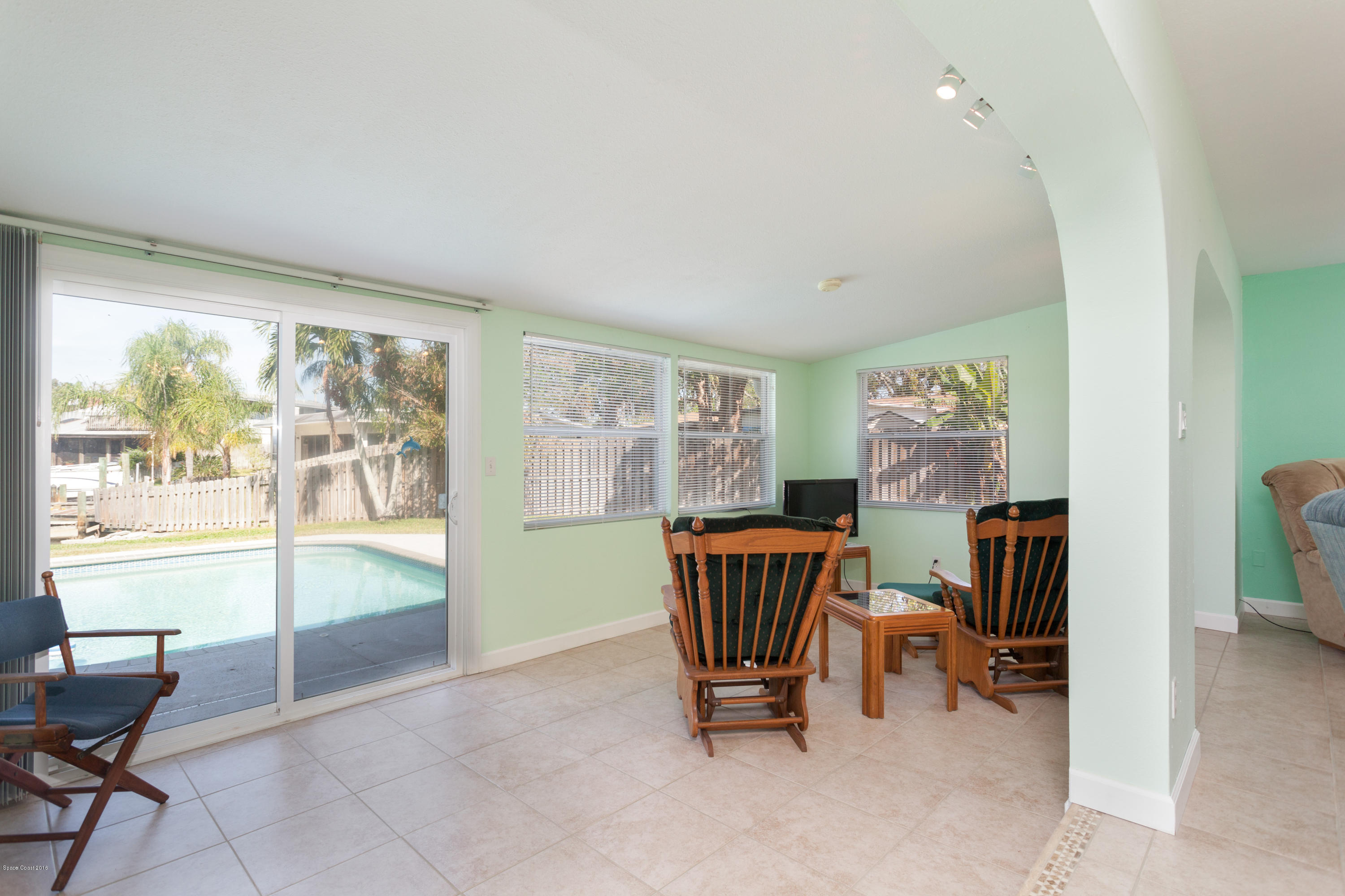 1035 Trinidad Road Cocoa Beach, FL 32931 - Photo 13 of 23 a living room with furniture and a window