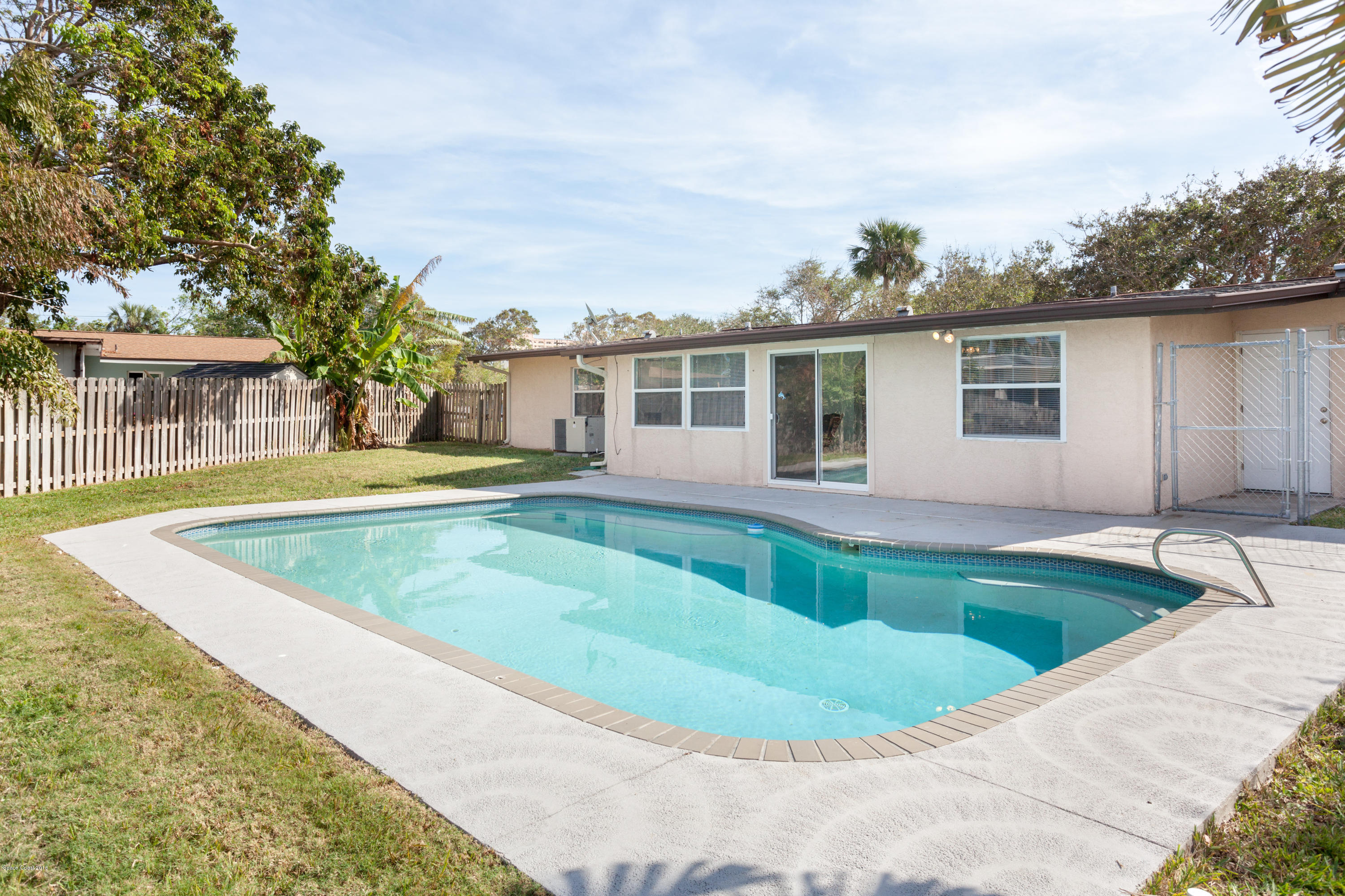 1035 Trinidad Road Cocoa Beach, FL 32931 - Photo 3 of 23 a view of outdoor space yard swimming pool and porch