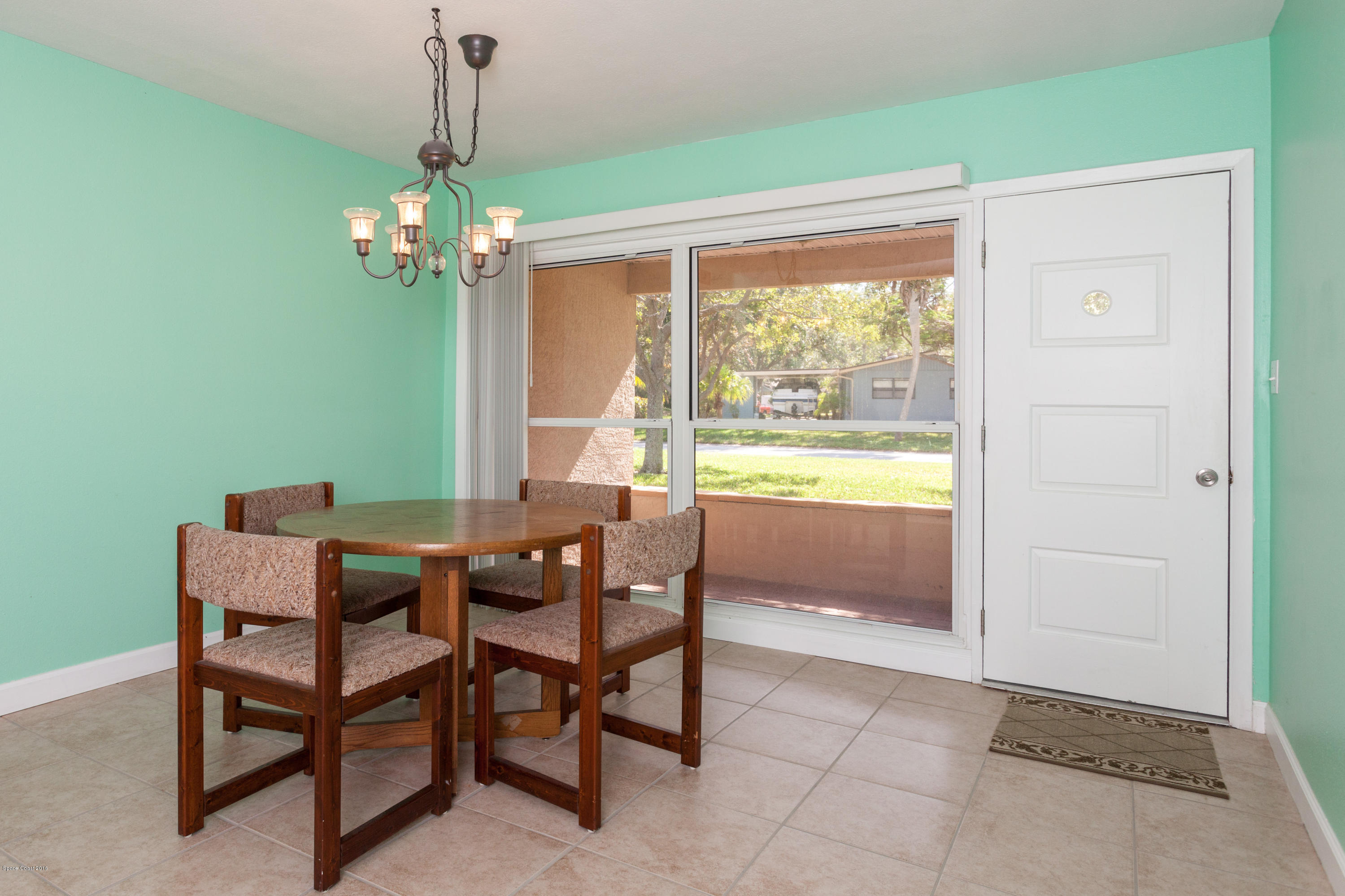 1035 Trinidad Road Cocoa Beach, FL 32931 - Photo 7 of 23 a view of a dining room with furniture window and outside view
