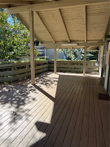 a view of a backyard with wooden floor